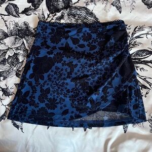 Urban Outfitters Jamie Surplice Knit Mini Skirt in a blue & black floral pattern